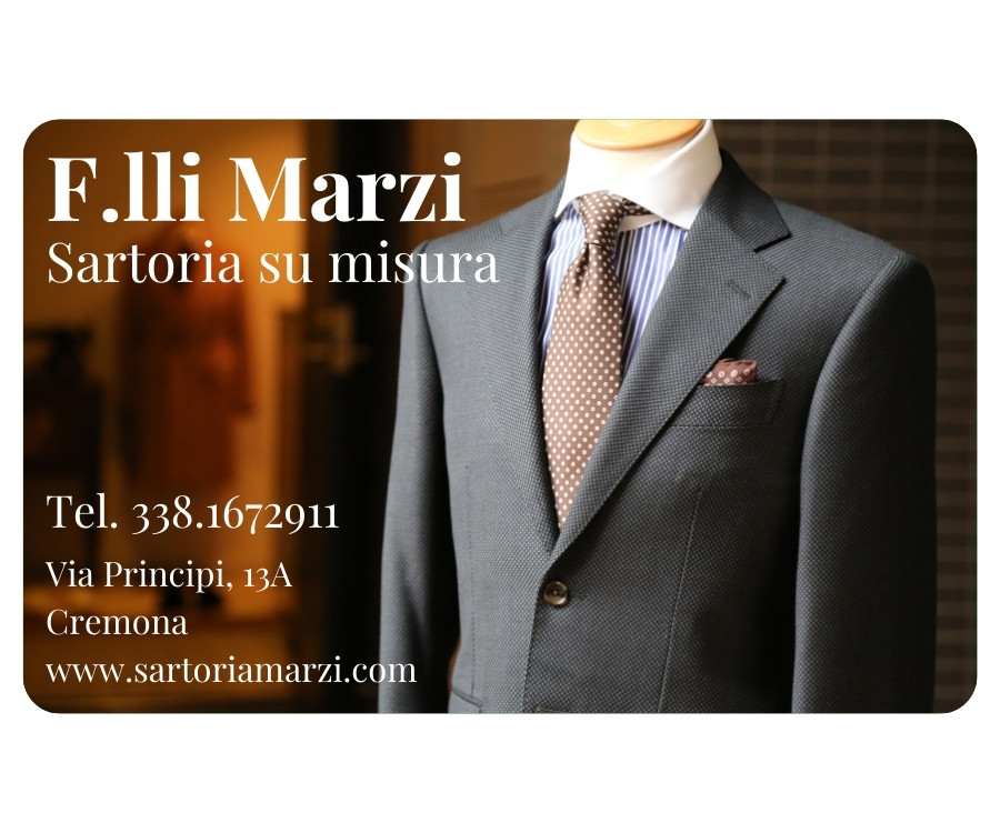 copertina personalizzata con immagine di una sartoria, logo e contatti